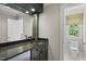 Entertain in style at this wet bar featuring a granite countertop and ample storage at 10825 Rondeau Woods Ct, Raleigh, NC 27614