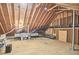 Spacious attic with exposed wood beams and plywood flooring, ready for storage or customization at 109 Hogan Glen Ct, Chapel Hill, NC 27516