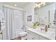 Bright bathroom features a single sink vanity, shower and tub combination at 109 Hogan Glen Ct, Chapel Hill, NC 27516
