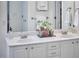 Bathroom vanity with double sinks and white cabinets at 109 Hogan Glen Ct, Chapel Hill, NC 27516