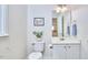 White bathroom features a single sink vanity and commode at 109 Hogan Glen Ct, Chapel Hill, NC 27516