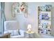Comfortable Bedroom chair with a side table and decorative shelving at 109 Hogan Glen Ct, Chapel Hill, NC 27516