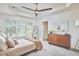 Bright bedroom with natural light, neutral tones, and ceiling fan at 109 Hogan Glen Ct, Chapel Hill, NC 27516
