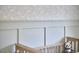 A soothing Bedroom with rabbit wallpaper and a wooden crib featuring an adorable plush panda at 109 Hogan Glen Ct, Chapel Hill, NC 27516
