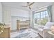 Bedroom with a crib, comfortable chair, and large windows offering plenty of sunlight at 109 Hogan Glen Ct, Chapel Hill, NC 27516