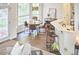 Cozy breakfast nook with wood table and chairs near windows and access to the breakfast bar at 109 Hogan Glen Ct, Chapel Hill, NC 27516