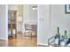 Elegant dining area with modern light fixture and views into the kitchen and white cabinets at 109 Hogan Glen Ct, Chapel Hill, NC 27516