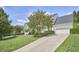 Lovely two-story home featuring an attached two-car garage, long driveway and manicured front lawn at 109 Hogan Glen Ct, Chapel Hill, NC 27516