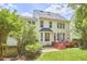Charming home with a backyard featuring a deck and lush green lawn at 109 Hogan Glen Ct, Chapel Hill, NC 27516