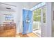 Bright foyer featuring a blue front door, hardwood floors, and a view of the dining room at 109 Hogan Glen Ct, Chapel Hill, NC 27516