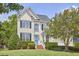 Charming two-story home with a well-manicured lawn and a welcoming blue front door at 109 Hogan Glen Ct, Chapel Hill, NC 27516