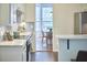 Modern kitchen offers stainless steel appliances, bright white counters and cabinets, and backyard views at 109 Hogan Glen Ct, Chapel Hill, NC 27516