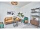 Bright living room featuring stylish furniture, modern art, and a large potted plant at 109 Hogan Glen Ct, Chapel Hill, NC 27516