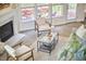 Bright living room features a fireplace, plush carpeting, and a comfortable seating area with deck access at 109 Hogan Glen Ct, Chapel Hill, NC 27516