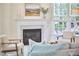 Comfortable living room with a fireplace, stylish furnishings, and a relaxing ambiance at 109 Hogan Glen Ct, Chapel Hill, NC 27516
