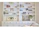 Custom built-in shelving adds stylish storage to this living area featuring lower cabinets and decor at 109 Hogan Glen Ct, Chapel Hill, NC 27516