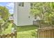 Side yard featuring a wooden fence, green lawn, and mature landscaping at 109 Hogan Glen Ct, Chapel Hill, NC 27516