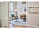 Cozy sitting room featuring a comfortable chair, stylish decor, and ample natural light at 109 Hogan Glen Ct, Chapel Hill, NC 27516