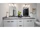 Bathroom features double vanity with stone countertop; ample storage and bright lighting enhance this spa-like retreat at 109 Lochview Dr, Cary, NC 27518