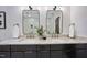 Double vanity bathroom with black cabinets, marble countertop, and stylish fixtures at 109 Lochview Dr, Cary, NC 27518