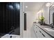 Modern bathroom with black tile shower and double vanity; stylish and functional design at 109 Lochview Dr, Cary, NC 27518