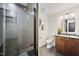 Modern bathroom featuring a tiled shower, granite countertop, and contemporary lighting at 109 Lochview Dr, Cary, NC 27518