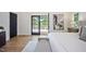 Bright bedroom with sliding glass doors to the deck offering peaceful views at 109 Lochview Dr, Cary, NC 27518