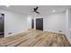 Spacious bedroom with hardwood floors, ceiling fan, and a view of a tiled shower at 109 Lochview Dr, Cary, NC 27518