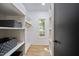 Well-organized walk-in closet featuring shelving, hanging space, and a window at 109 Lochview Dr, Cary, NC 27518