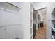 Bright walk-in closet with ample shelving, hanging space, and contemporary design at 109 Lochview Dr, Cary, NC 27518