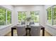 Dining room featuring an elegant wood table and four stylish upholstered chairs at 109 Lochview Dr, Cary, NC 27518