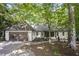 Charming single-story home with a brick driveway, attached garage, and a well-manicured front yard at 109 Lochview Dr, Cary, NC 27518