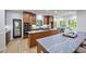Spacious kitchen with stainless steel appliances, dual islands, and wood cabinets at 109 Lochview Dr, Cary, NC 27518