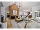 Spacious living room with a brick fireplace, vaulted ceiling, and an open layout leading to the kitchen at 109 Lochview Dr, Cary, NC 27518