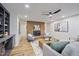 Comfortable living room features brick fireplace, modern furnishings, and built-in shelving at 109 Lochview Dr, Cary, NC 27518