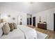 Bright main bedroom features hardwood floors, white walls, ensuite bathroom and modern decor at 109 Lochview Dr, Cary, NC 27518