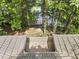 Aerial shot of home roof with deck access and a partial view of a lake and its shoreline at 109 Lochview Dr, Cary, NC 27518