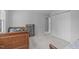 Spacious bedroom features neutral carpet, closet, and a bookcase for convenient storage at 1095 Vauxhall Dr, Apex, NC 27502