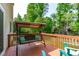 The peaceful back deck boasts a porch swing and overlooks a private yard at 1095 Vauxhall Dr, Apex, NC 27502