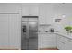 Kitchen with stainless steel refrigerator and white cabinets at 1095 Vauxhall Dr, Apex, NC 27502