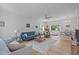 Bright living room with hardwood floors, neutral walls, and a cozy seating area at 1095 Vauxhall Dr, Apex, NC 27502