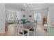 Open-concept living room featuring hardwood floors, comfortable seating and plenty of natural light at 1095 Vauxhall Dr, Apex, NC 27502