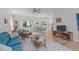Bright living room with hardwood floors, neutral walls, and a cozy seating area at 1095 Vauxhall Dr, Apex, NC 27502
