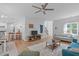 Bright living room with hardwood floors, neutral walls, and a cozy seating area at 1095 Vauxhall Dr, Apex, NC 27502