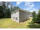 Exterior of home, featuring a spacious backyard and manicured lawn at 11 Mamie Ferguson Dr, Lillington, NC 27546