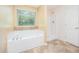A bathroom featuring tile floors, a standalone tub and a standing shower at 11 Mamie Ferguson Dr, Lillington, NC 27546