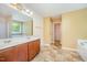A bathroom that features a double sink vanity, tile floors and an additional bathtub at 11 Mamie Ferguson Dr, Lillington, NC 27546