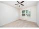 Neutral bedroom featuring carpet, a ceiling fan, and a window with natural light at 11 Mamie Ferguson Dr, Lillington, NC 27546