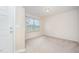 Bright, carpeted bedroom with natural light streaming through the window at 11 Mamie Ferguson Dr, Lillington, NC 27546