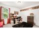 Bedroom featuring a desk with a rolling office chair, a window, and comic book decor on the wall at 11 Mamie Ferguson Dr, Lillington, NC 27546